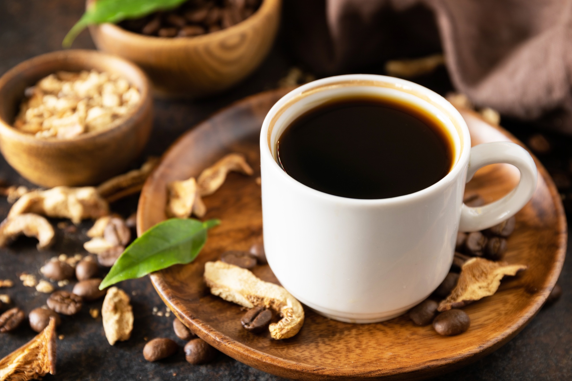 Mushroom coffee in a cup and coffee beans, trendy drink.